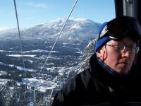 Back up the mountain in the gondola with a shifty looking bloke - click for full size image